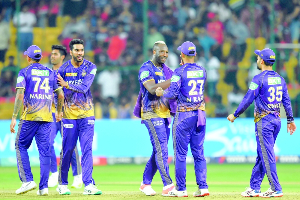 Kolkata Knight Riders' players celebrate after winning the Indian Premier League (IPL) Twenty20 cricket match between Royal Challengers Bangalore and Kolkata Knight Riders at the M Chinnaswamy Stadium in Bengaluru on April 26, 2023. (Photo by Manjunath KIRAN / AFP)

