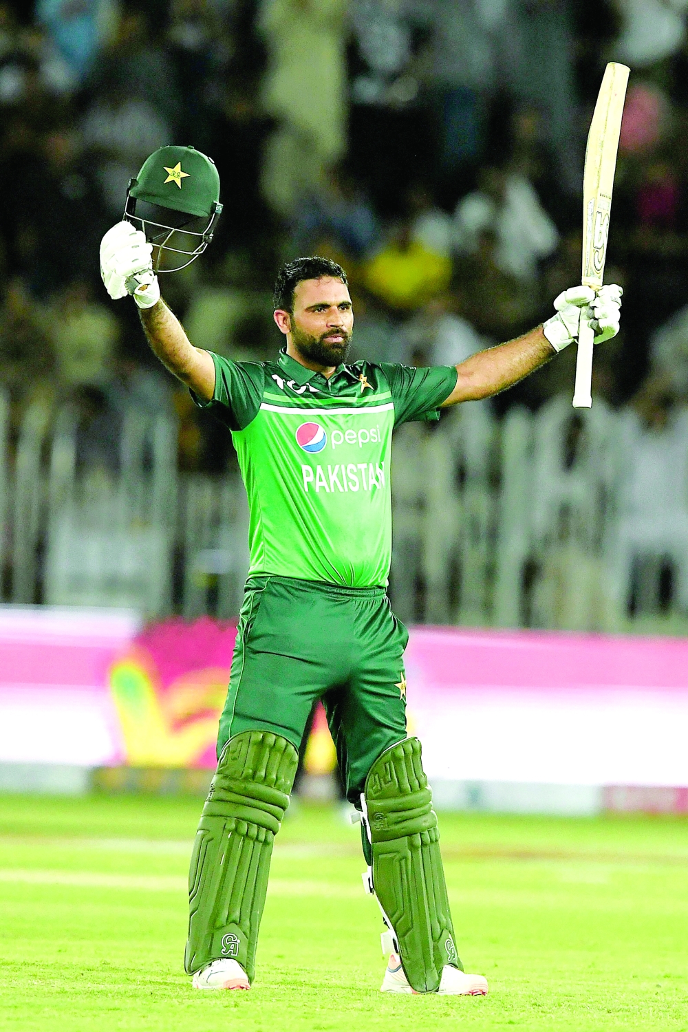 Pakistan's Fakhar Zaman celebrates after scoring a century (100 runs) during the first one-day international (ODI) cricket match between Pakistan and New Zealand at the Rawalpindi Cricket Stadium in Rawalpindi, on April 27, 2023.  (Photo by Aamir QURESHI / AFP)

