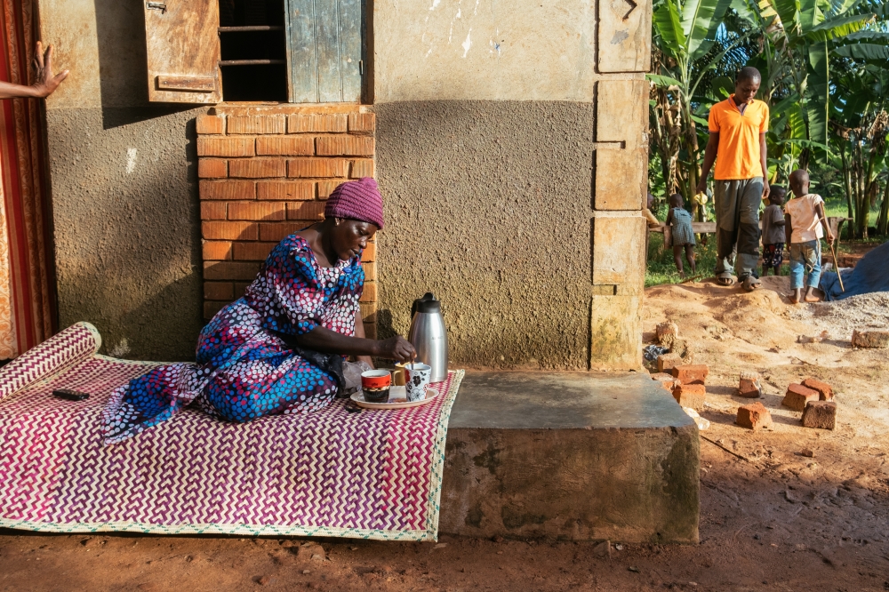 Margaret Nasamba prepares herself an evening cup of coffee in Zirobwe in Zirobwe, Uganda, March 29, 2023. (Khadija Farah/The New York Times)
