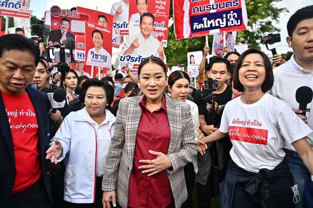 Pheu Thai Party candidate Paetongtarn Shinawatra arrives for the first day of the constituencies candidates registration ahead of Thailand's general election, in Bangkok.