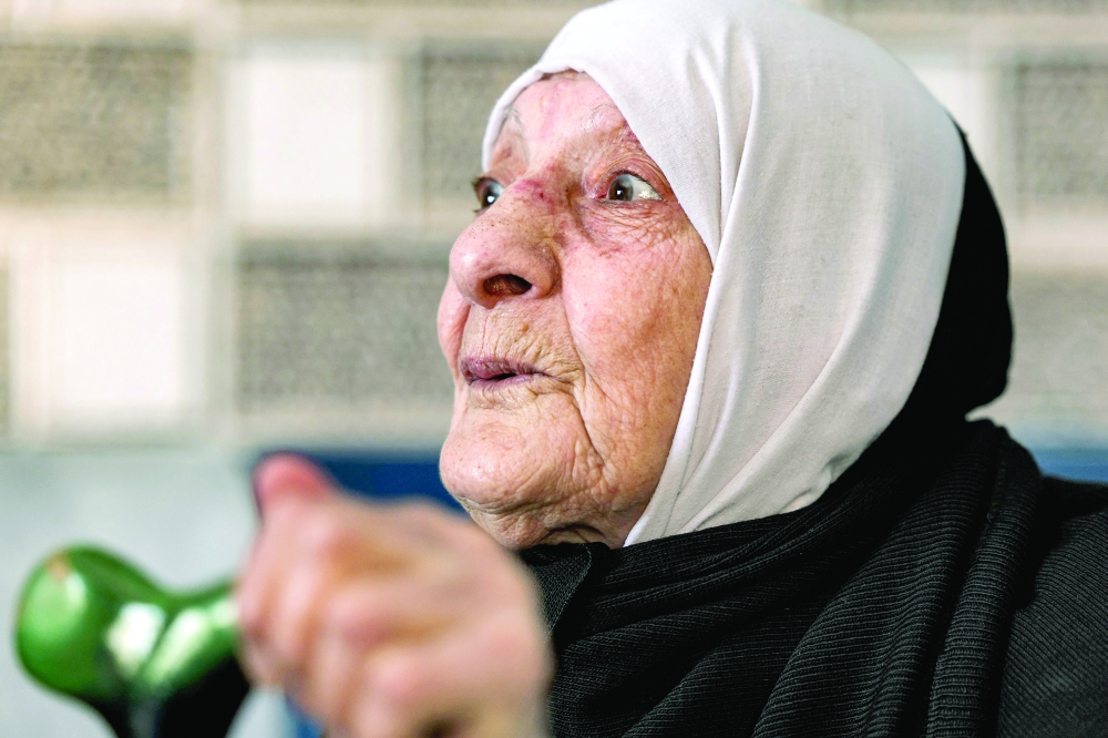Amina al Dibai recounts her story during an interview at the Rafah camp in the southern Gaza Strip. - AFP