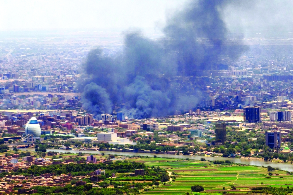 Smoke billows during fighting in the Sudanese capital Khartoum. — AFP