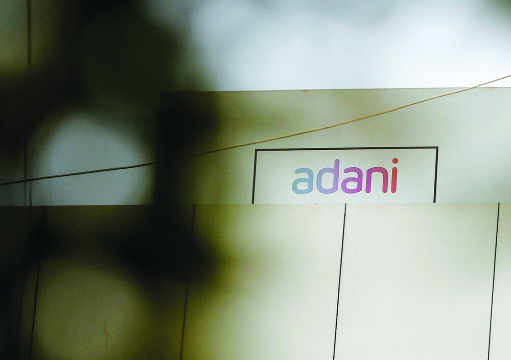 The logo of the Adani Group is seen on one of its buildings in Ahmedabad