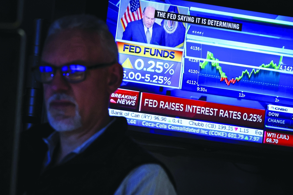 Traders react to Fed rate announcement on the floor of the NYSE in New York