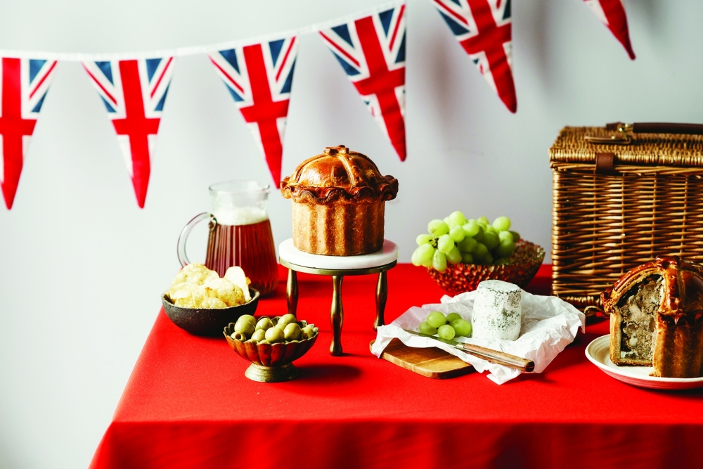 Coronation-related foods, including, on a pedestal, the limited-edition Crown Jewel Celebration Pork Pie, created by Calum Franklin in collaboration with the pie maker Dickinson & Morris in London. 