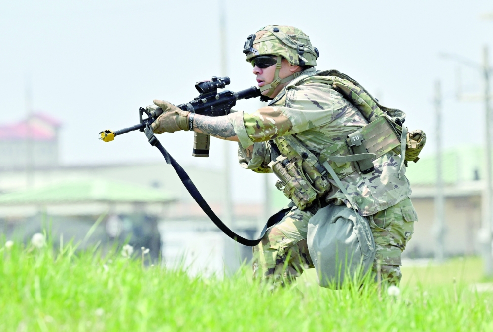 A US soldier takes part in an air assault during the Best Squad Competition, conducted by the US 2nd Infantry Division and the ROK-US Combined Division at the US Army's Camp Humphreys in Pyeongtaek. - AFP


