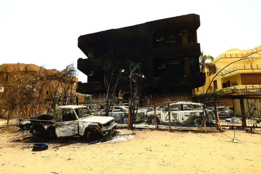 Damaged cars and buildings are seen at the central market during clashes between the paramilitary Rapid Support Forces and the army in Khartoum North, Sudan. - REUTERS