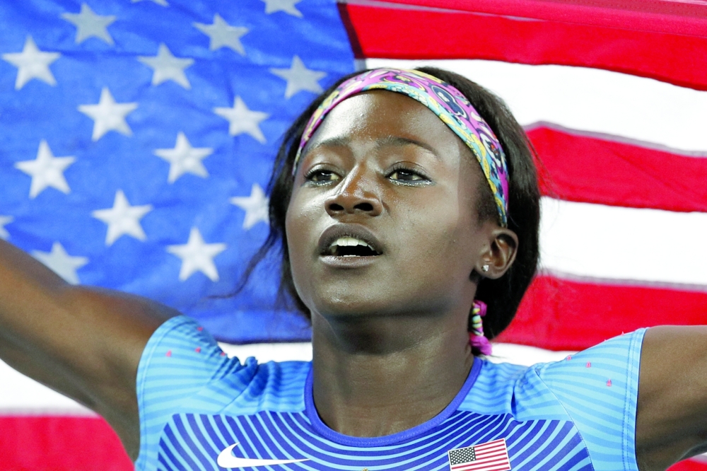 (FILES) Silver medallist USA's Tori Bowie celebrates after the Women's 100m Final during the athletics event at the Rio 2016 Olympic Games at the Olympic Stadium in Rio de Janeiro. Tori Bowie, the 100m silver medallist at the 2016 Rio Olympics and the 2017 world champion, has died at the age of 32, USA Track and Field and her management company said on Wednesday. (Photo by Adrian DENNIS / AFP)

