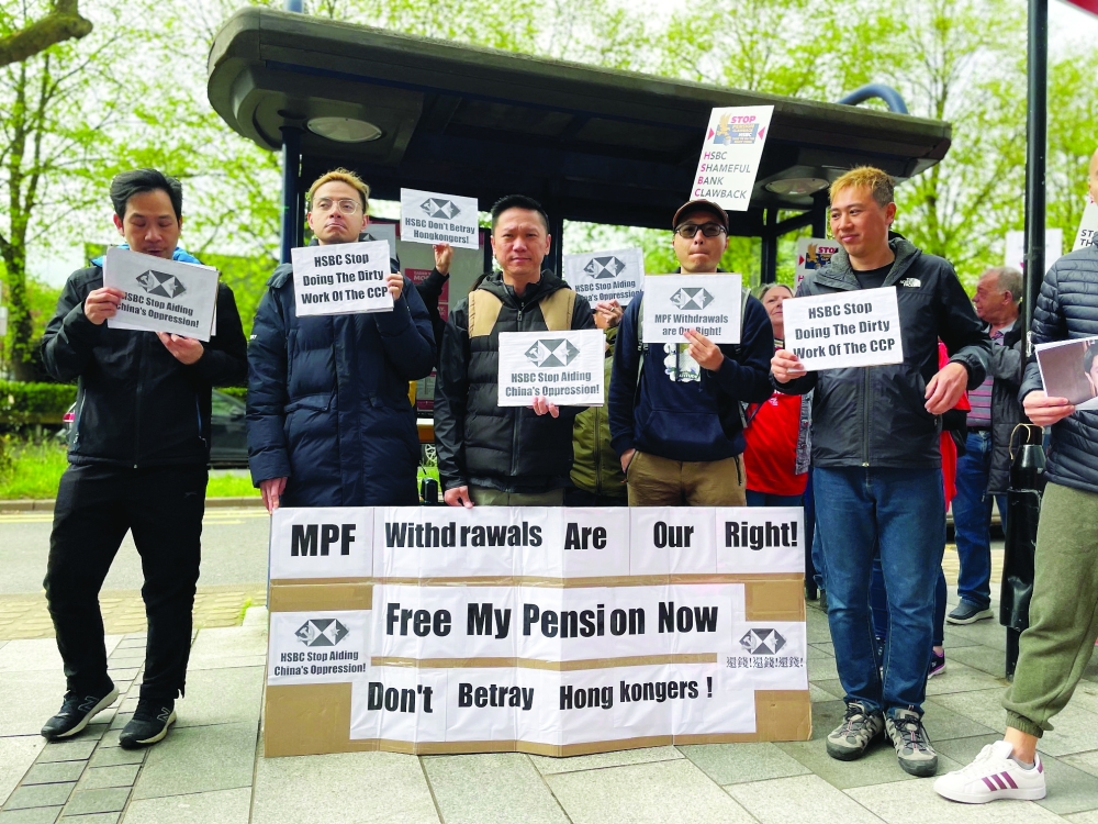 People protest outside the headquarters of HSBC during the annual general meeting in Birmingham, Britain. — Reuters