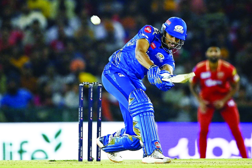 Mumbai Indians' Tilak Varma plays a shot during the Indian Premier League (IPL) Twenty20 cricket match between Punjab Kings and Mumbai Indians at the Punjab Cricket Association Stadium in Mohali. -- AFP

