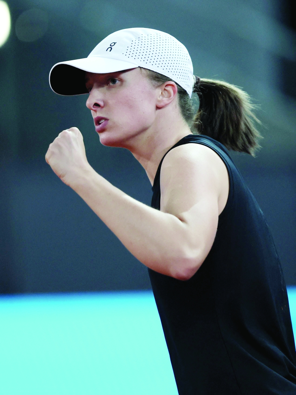 Poland's Iga Swiatek reacts during the 2023 WTA Tour Madrid Open tennis tournament singles semi-final match against Russia's Veronika Kudermetova at Caja Magica in Madrid on May 4, 2023. (Photo by Thomas COEX / AFP)

