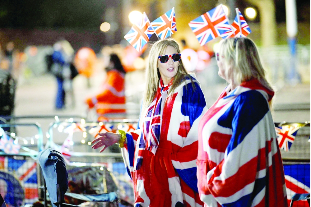 Royal fans camp out along the procession route on The Mall, near to Buckingham Palace in central London ahead of the coronation weekend. — AFP