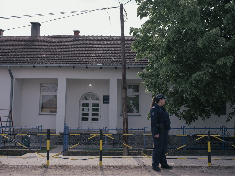A police officer patrolling in the village of Dubona, Serbia, after the countrys second mass shooting in less than a week, May 5, 2023. (Vladimir Zivojinovic/The New York Times)