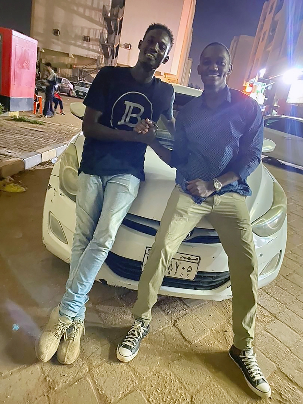 An undated photo via Hassan Tibwa of himself, right, and Sami al-Gada. (via Hassan Tibwa via The New York Times)