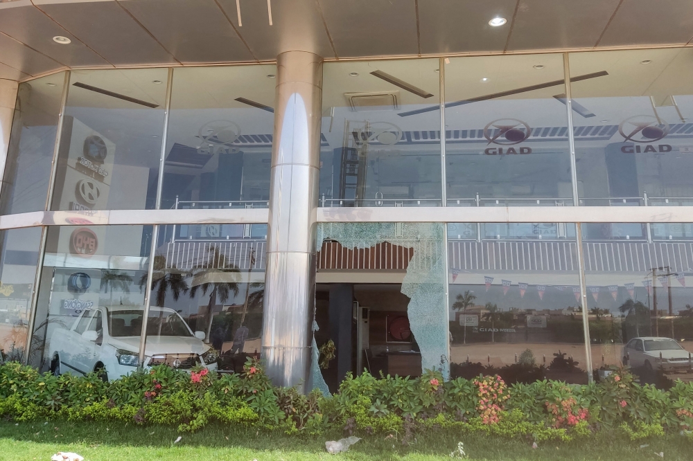  The broken glass of a car showroom in southern Khartoum after a looting attempt 