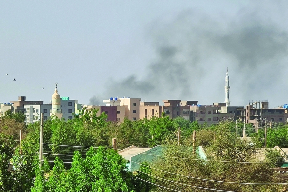 Smoke billows in Khartoum amid ongoing fighting between the forces of two rival generals. — AFP 