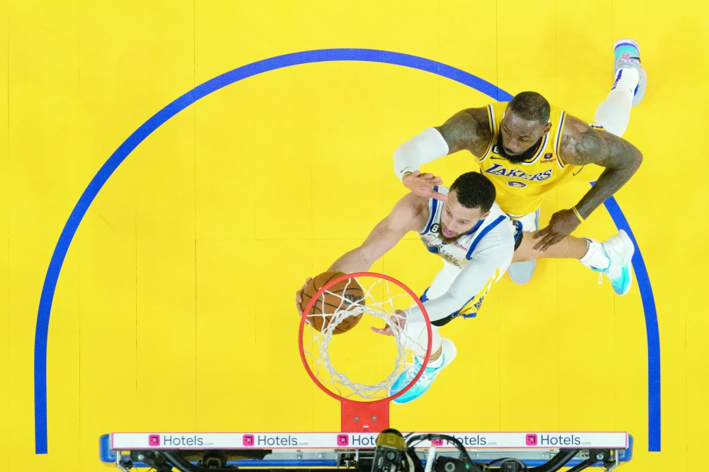 Golden State Warriors guard Stephen Curry (30) shoots the basketball against Los Angeles Lakers forward LeBron James (6) during the second half in game five of the 2023 NBA playoffs conference semifinals round at Chase Center. Mandatory Credit: Kyle Terada-USA TODAY Sports