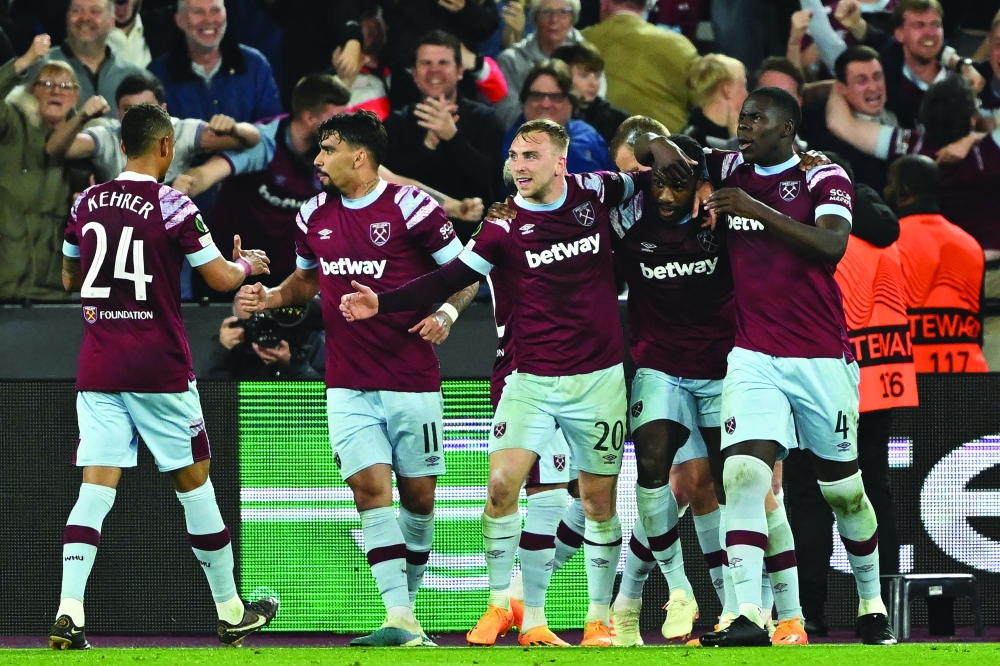 West Ham United's English midfielder Michail Antonio (2R) celebrates with teammates after scoring their second goal during the UEFA Europa Conference League semi-final first leg football match between West Ham United and AZ Alkmaar at the London Stadium in east London on May 11, 2023. (Photo by JUSTIN TALLIS / AFP)

