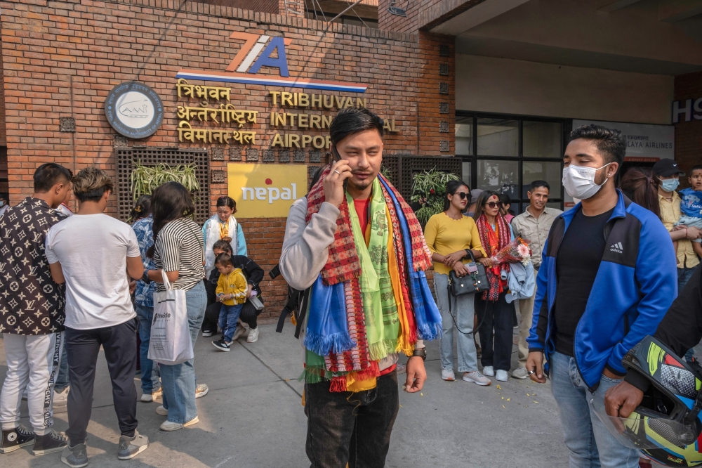 Young Nepalis, many of whom go overseas for employment or schooling, at the airport in Kathmandu, Nepal, Nov. 18, 2022. (Saumya Khandelwal/The New York Times)