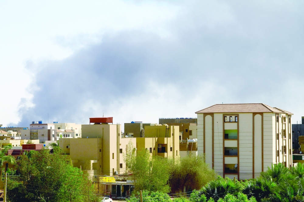 Smoke billows in the distance in Khartoum amid ongoing fighting between the forces of two rival generals. — AFP