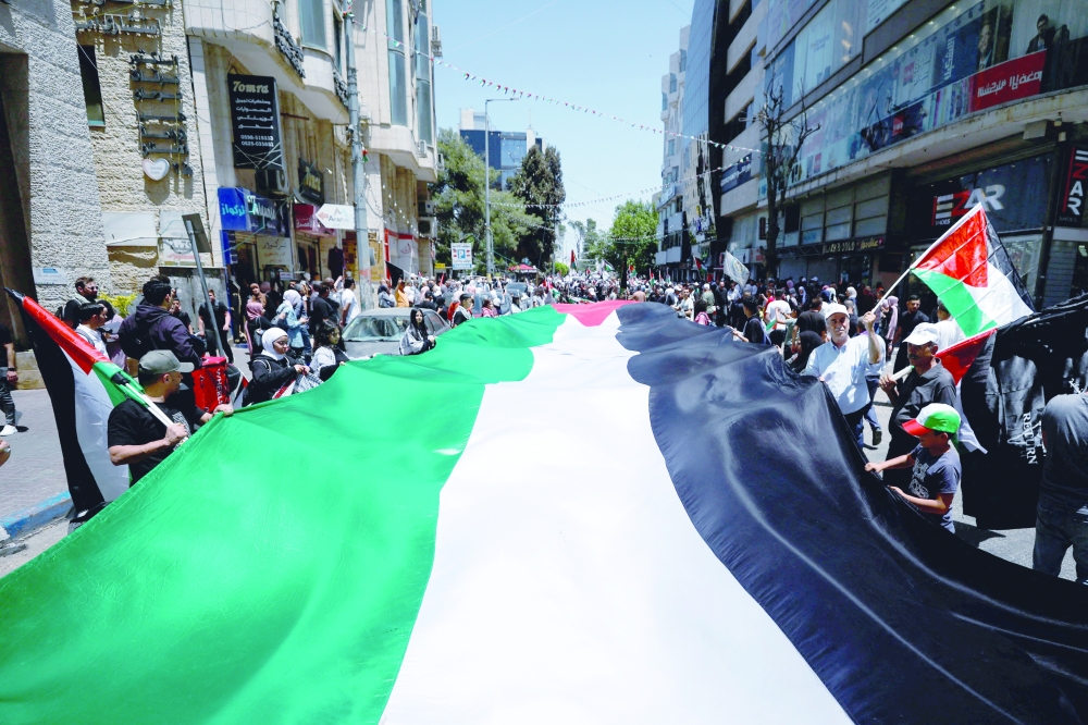 Palestinians react during a rally as they mark the 75th anniversary of Nakba in Ramallah in the Israeli-occupied West Bank. — Reuters 