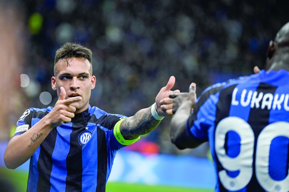 TOPSHOT - Inter Milan's Argentinian forward Lautaro Martinez celebrates after opening the scoring  during the UEFA Champions League semi-final second leg football match between Inter Milan and AC Milan on May 16, 2023 at tyhe Giuseppe-Meazza (San Siro) stadium in Milan. (Photo by GABRIEL BOUYS / AFP)

