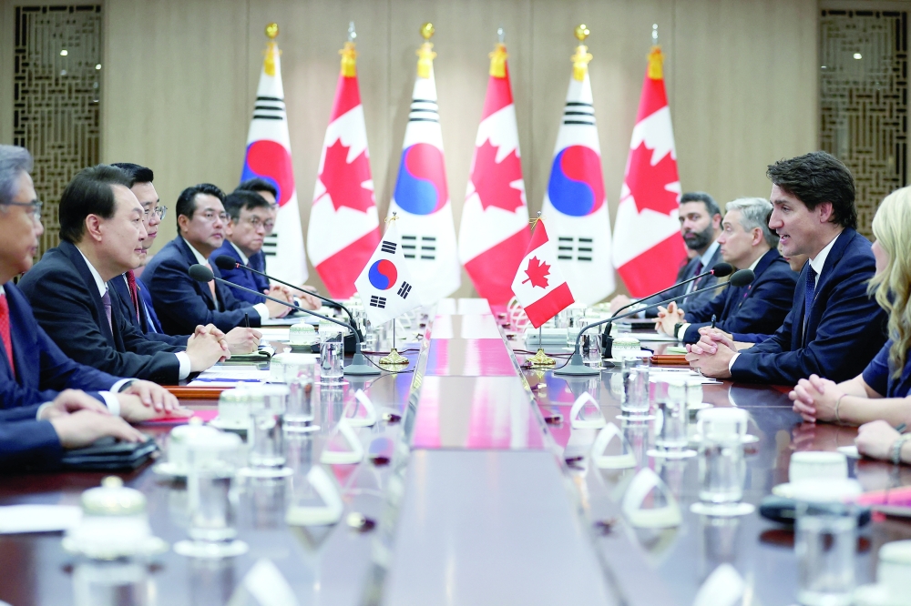Canada’s PM Justin Trudeau talks with S. Korea’s President Yoon Suk Yeol during their meeting at the Presidential Office in Seoul. — Reuters