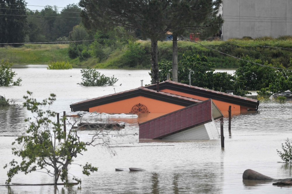 Flooded bungalows are pictured following heavy rains in Cesena in central Italy. — AFP