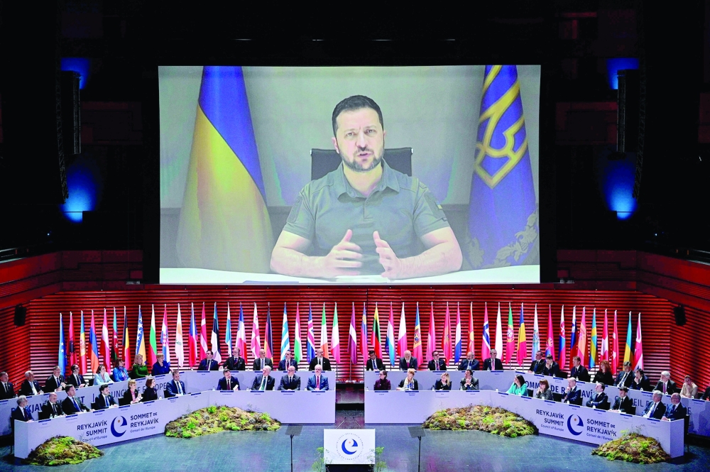 Zelensky appears on screen to speak in the 4th Summit of the Heads of State and Government of the Council of Europe, in Reykjavik, Iceland. — AFP