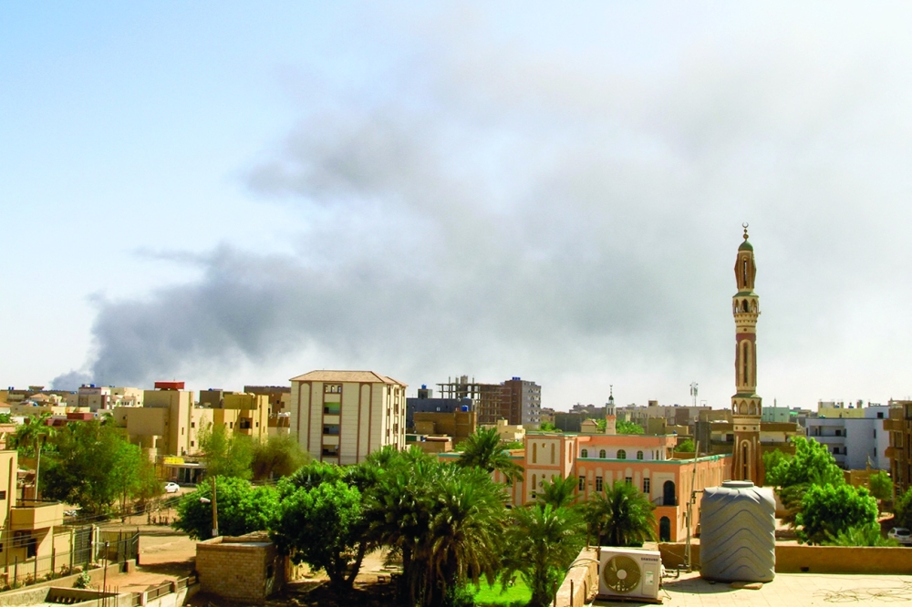 Smoke billows in the distance in Khartoum amid ongoing fighting between the forces of two rival generals. — AFP