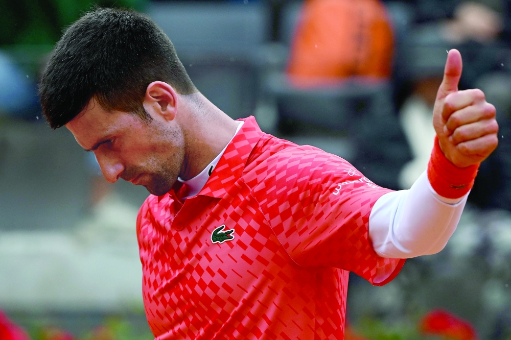 Serbia's Novak Djokovic reacts during his quarterfinals match of the Men's ATP Rome Open tennis tournament against Denmark's Holger Rune, at Foro Italico in Rome on May 17, 2023.  (Photo by Filippo MONTEFORTE / AFP)

