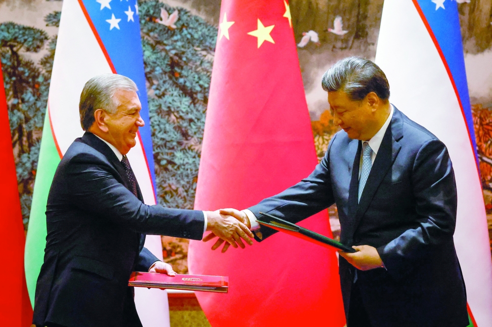 Chinese President Xi Jinping and Uzbekistan President Shavkat Mirziyoyev during a signing ceremony on the sidelines of the China-Central Asia Summit in Xian, Shaanxi province. — AFP