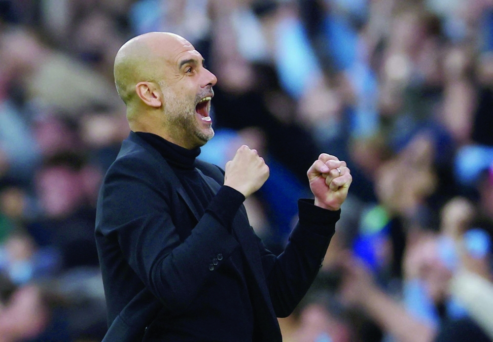 Soccer Football - Champions League - Semi Final - Second Leg - Manchester City v Real Madrid - Etihad Stadium, Manchester, Britain - May 17, 2023 Manchester City manager Pep Guardiola celebrates their first goal scored by Bernardo Silva REUTERS/Molly Darlington     TPX IMAGES OF THE DAY
