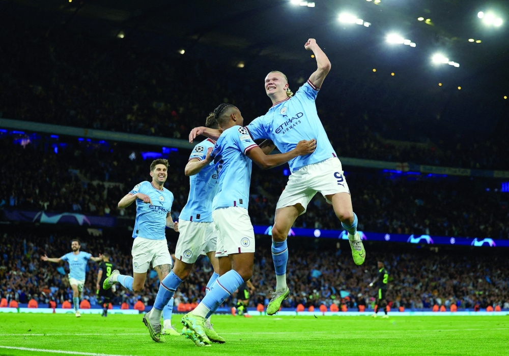 Soccer Football - Champions League - Semi Final - Second Leg - Manchester City v Real Madrid - Etihad Stadium, Manchester, Britain - May 17, 2023 Manchester City's John Stones, Erling Braut Haaland, Manuel Akanji and Ruben Dias celebrate their third goal an own goal scored by Real Madrid's Eder Militao REUTERS/Molly Darlington     TPX IMAGES OF THE DAY
