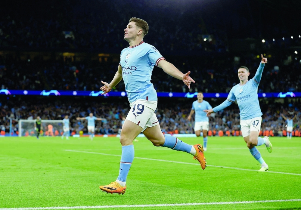 Soccer Football - Champions League - Semi Final - Second Leg - Manchester City v Real Madrid - Etihad Stadium, Manchester, Britain - May 17, 2023  Manchester City's Julian Alvarez celebrates scoring their fourth goal with Phil Foden Action Images via Reuters/Jason Cairnduff
