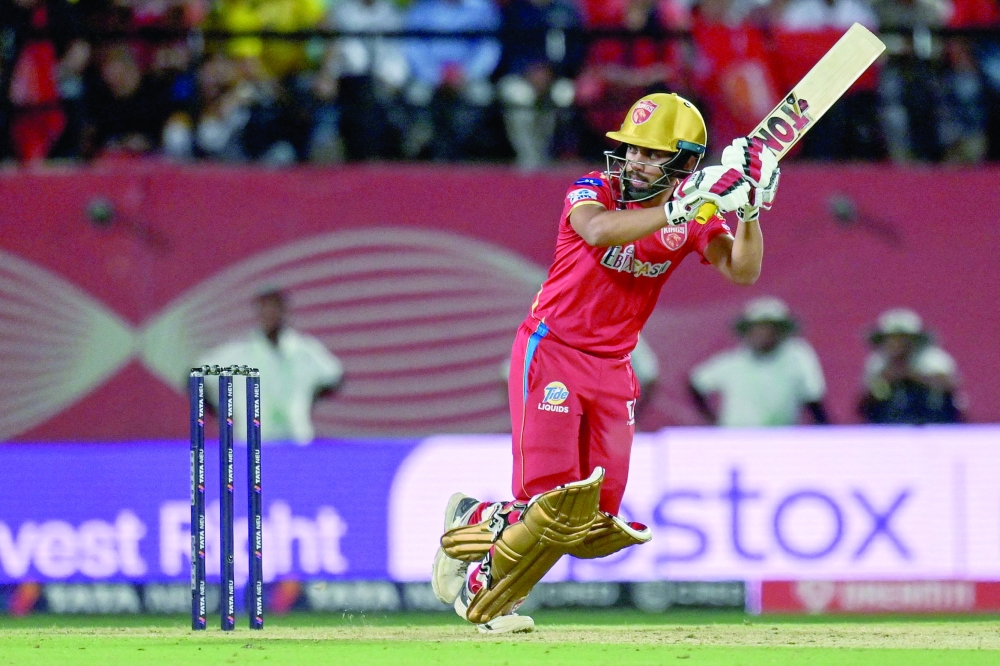 Punjab Kings' Atharva Taide plays a shot during the Indian Premier League (IPL) Twenty20 cricket match between Punjab Kings and Delhi Capitals at the Himachal Pradesh Cricket Association Stadium in Dharamsala on May 17, 2023. (Photo by Money SHARMA / AFP)

