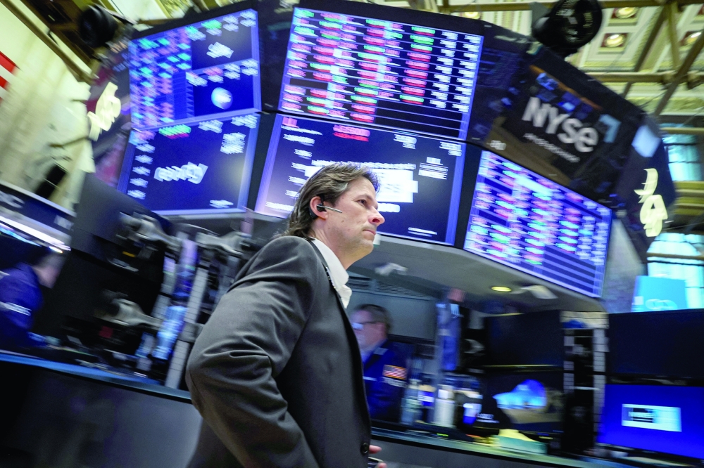 Traders work on the floor of the New York Stock Exchange (NYSE) in New York City. - Reuters