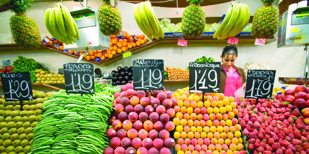 A woman works at a fruit market in Sao Paulo, Brazil. — Reuters