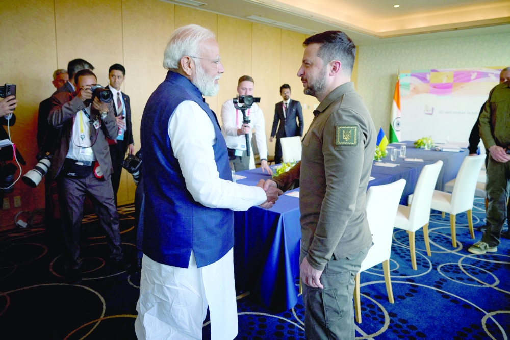 Ukraine's President Volodymyr Zelenskiy and Indian PM Narendra Modi shake hands during the G7 leaders' summit in Hiroshima, Japan. —Reuters