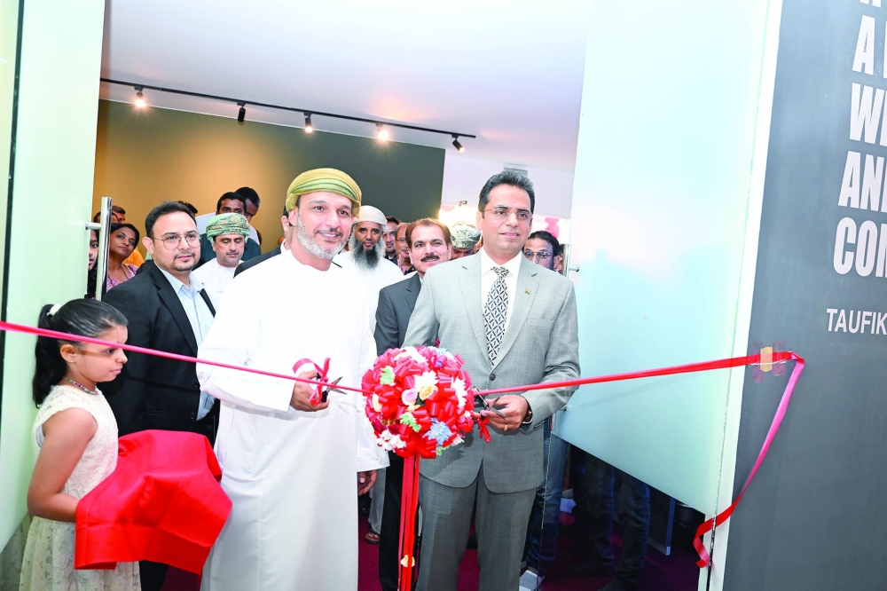 Indian Ambassador Amit Narang and Hisham Juma al Sinani (DG of Sports, Welfare and Development, Ministry of Culture, Sports and Youth), open the AMM Sports Arena. -- Khalfan al Rusaiqi