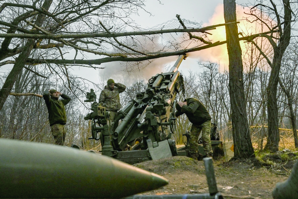 Ukrainian servicemen fire a M777 howitzer at Russian positions near Bakhmut, eastern Ukraine. — AFP 