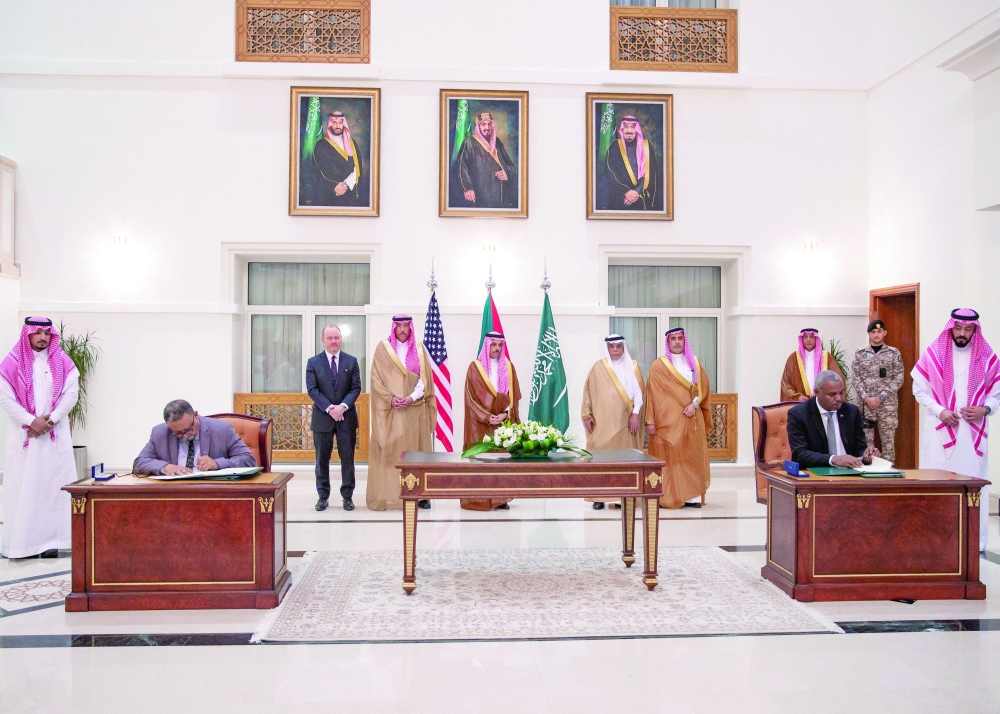 Saudi FM stands along with other officials as representatives of the Sudanese army and rival paramilitary Rapid Support Forces sign an agreement for a seven-day ceasefire in Jeddah. — Reuters 