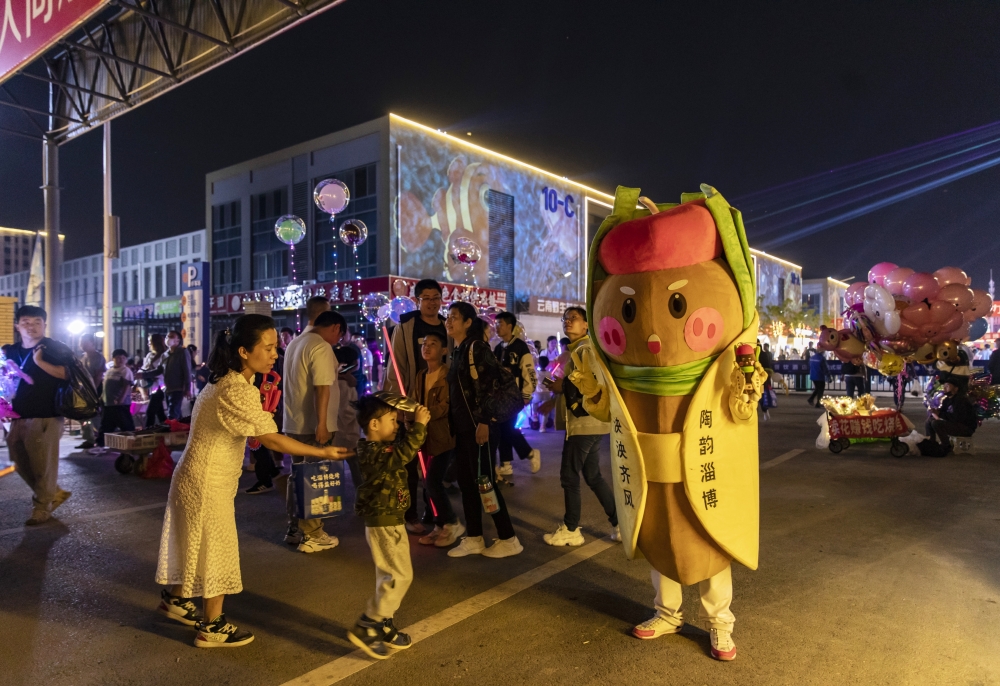 A barbecue meat skewer mascot in Zibo, China, May 2, 2023. (Qilai Shen/The New York Times)
