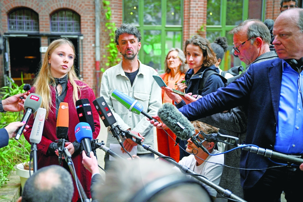 Climate change activist of the Last Generation, Aimee Van Baalen, answers media questions after holding a press conference in Berlin. — Reuters