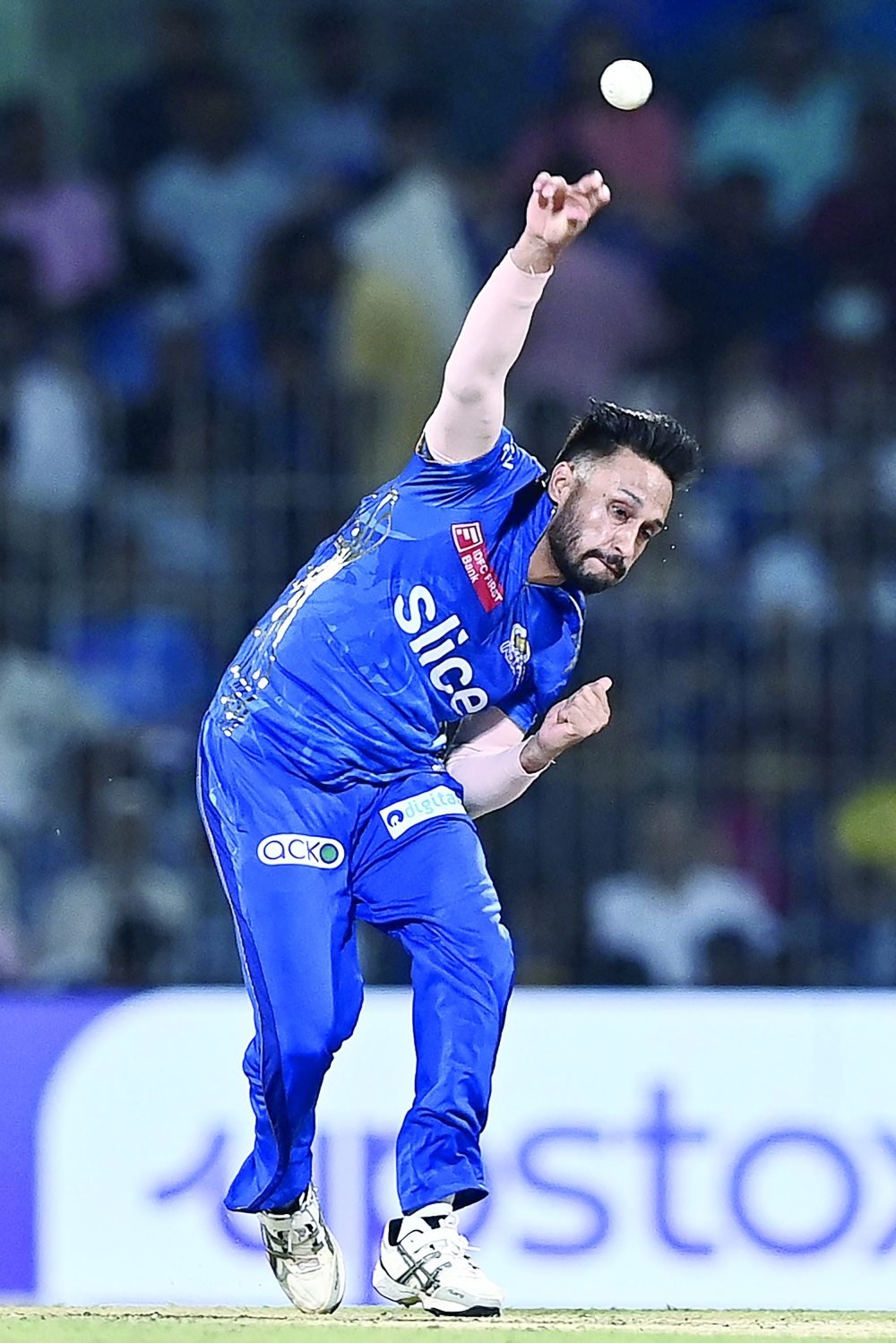 Mumbai Indians' Akash Madhwal delivers a ball during the Indian Premier League (IPL) Twenty20 eliminator cricket match between Lucknow Super Giants and Mumbai Indians at the MA Chidambaram Stadium in Chennai on May 24, 2023. (Photo by R. Satish BABU / AFP)

