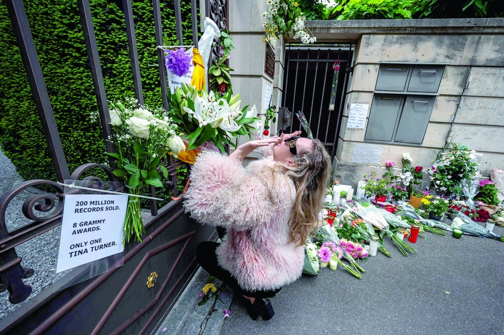 A woman pays her respects outside the estate of late singer Tina Turner following the announcement of her death in Kusnacht. - AFP