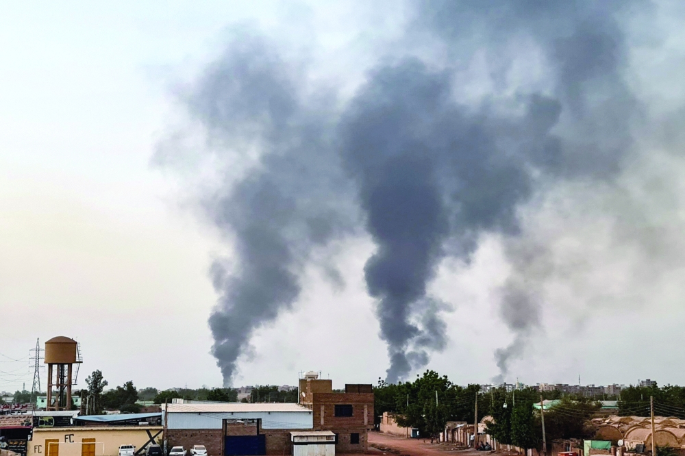 Smoke rises above buildings in Khartoum. - AFP 