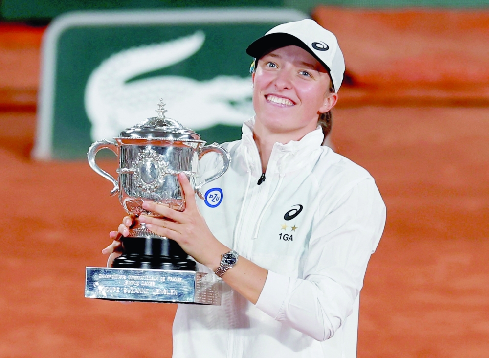 Poland's Iga Swiatek poses with trophy after winning the women's singles final match against Cori Gauff of the US. REUTERS