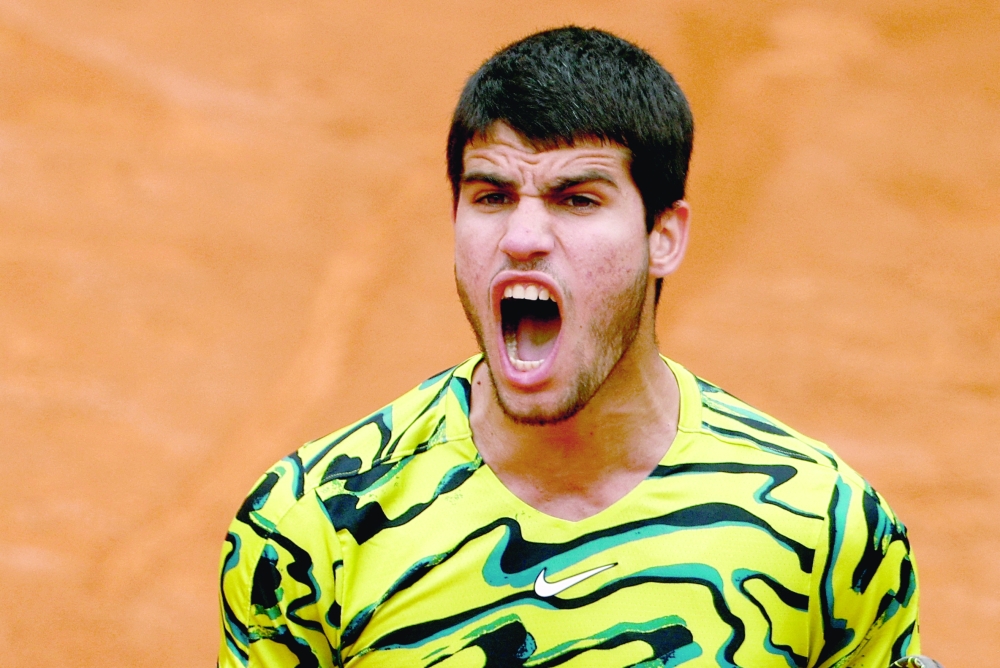 FILE PHOTO: Tennis - Italian Open - Foro Italico, Rome, Italy - May 15, 2023 Spain's Carlos Alcaraz reacts during his round of 32 match against Hungary's Fabian Marozsan REUTERS/Guglielmo Mangiapane/File Photo
