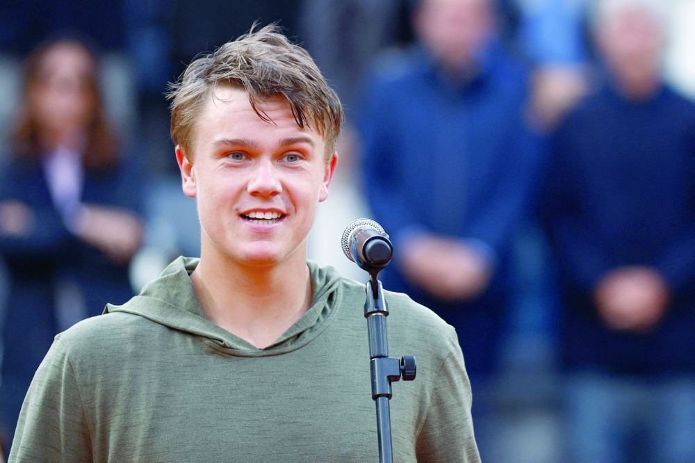 Tennis - Italian Open - Foro Italico, Rome, Italy - May 21, 2023 Denmark's Holger Rune speaks into a microphone during the trophy presentation after losing the men's singles final against Russia's Daniil Medvedev REUTERS/Guglielmo Mangiapane
